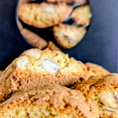 Close up of Giannetti Artisans Almond Biscotti with black packaging in background