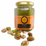 One 7 oz  jar of Giannetti Artisans pistachio pesto sauce on white background