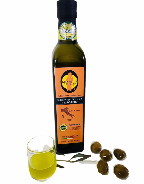 Italian olive oil from Tuscany by Giannetti Artisans in a 16.9 oz bottle next to a glass of oil and olives.