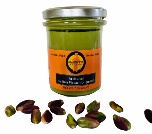Sicilian Pistachio Spread One 7 oz jar of Giannetti Artisans Sicilian Pistachio Spread with pistachios in front of the jar on a white background