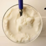Top view of Sicilian Almond Granita with spoon dipped into the bowl for Giannetti Artisans Almond paste uses
