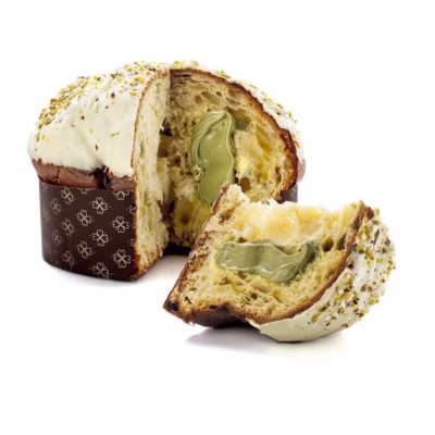 A sliced Giannetti Artisans Panettone cake showing a pistachio spread filling inside the cake