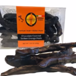 Clear box of Giannetti Artisans chocolate orange peels with a few orange peels on the side of the box for demonstrative purposes