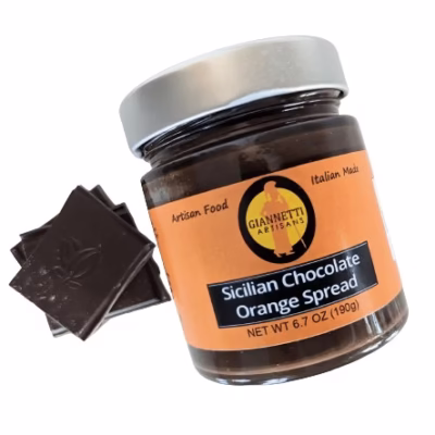 Top view of Giannetti Artisans Sicilian Chocolate Orange Spread 7 oz jar with chocolate pieces on a white background