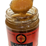 7 oz jar of Giannetti Artisans Bergamot Jam from Italy with spoon showing marmalade texture