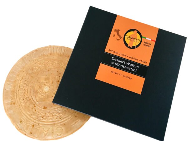 Top view of a black packaging box and one Giannetti Artisans montecatini wafer on a white background